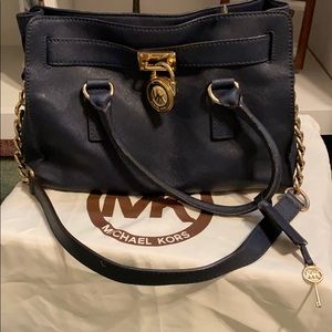 Micheal kors purse. Blue with gold.